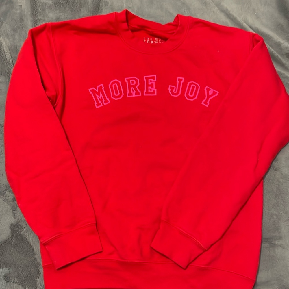 The Shop Forward More Joy sweater.